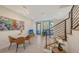 Combined dining and living space featuring modern decor and a staircase at 1774 10Th St, Sarasota, FL 34236