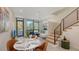 Open living room, modern staircase, lots of natural light, and a combined dining area at 1774 10Th St, Sarasota, FL 34236