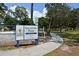 Gillespie Park sign with established date and park amenities like walking path and playground at 1774 10Th St, Sarasota, FL 34236