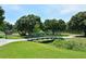 Scenic view of park featuring a green bridge, mature trees and walking path at 1774 10Th St, Sarasota, FL 34236