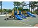Community playground with slides, climbing structures and mature shade trees at 1774 10Th St, Sarasota, FL 34236