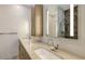 Bathroom with double sinks, granite countertops, and a view of the shower, offering functionality and style at 1778 10Th St, Sarasota, FL 34236