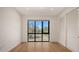 Spacious bedroom bathed in natural light, with a large window overlooking the outdoors and a convenient closet at 1778 10Th St, Sarasota, FL 34236