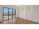 Bright bedroom with a view, complemented by a closet and hardwood floors, creating a welcoming atmosphere at 1778 10Th St, Sarasota, FL 34236