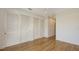 Bedroom with a view, enhanced by ample storage in the closet and the warmth of hardwood floors at 1778 10Th St, Sarasota, FL 34236
