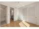 Bright bedroom with a closet and a door that leads to a bathroom, offering a comfortable and private space at 1778 10Th St, Sarasota, FL 34236