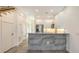 Open kitchen with stainless steel appliances, breakfast bar with tile front, and access to other rooms at 1778 10Th St, Sarasota, FL 34236