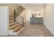 Stylish living room with wood stairs and a modern kitchen in the background at 1778 10Th St, Sarasota, FL 34236