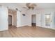 Large bedroom with a ceiling fan, wood-look floors, and natural light at 3920 Bal Harbor Blvd # E1, Punta Gorda, FL 33950