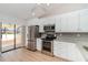 Modern kitchen with stainless steel appliances, granite counters, and plenty of cabinet space at 3920 Bal Harbor Blvd # E1, Punta Gorda, FL 33950
