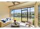 Enclosed lanai features beautiful waterfront views, tiled floor, and comfortable seating area at 3920 Bal Harbor Blvd # E1, Punta Gorda, FL 33950