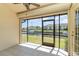 Enclosed lanai featuring scenic waterfront views, tile floors, and screen windows at 3920 Bal Harbor Blvd # E1, Punta Gorda, FL 33950
