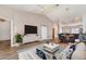 Bright living room features modern decor, wood floors, and open floor plan at 3920 Bal Harbor Blvd # E1, Punta Gorda, FL 33950