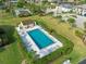 Aerial view of the outdoor pool and well-maintained landscaping in this community at 3920 Bal Harbor Blvd # E1, Punta Gorda, FL 33950