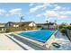 Community pool featuring mature landscaping and a pool cover at 3920 Bal Harbor Blvd # E1, Punta Gorda, FL 33950