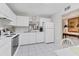 Efficient kitchen with white cabinetry, appliances, and ample counter space, providing a functional cooking area at 542 Lakeside Dr # 542, Bradenton, FL 34210