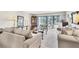 Inviting living room with large windows, neutral colors, and comfortable seating for relaxation at 542 Lakeside Dr # 542, Bradenton, FL 34210