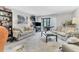 Cozy living room with carpeted floors, comfortable seating, and view of trees at 542 Lakeside Dr # 542, Bradenton, FL 34210