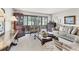 Well-lit living room featuring comfortable furniture, large windows, and tasteful décor for a welcoming atmosphere at 542 Lakeside Dr # 542, Bradenton, FL 34210