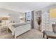 Serene bedroom with soft carpeting, neutral tones, and a white-painted dresser at 542 Lakeside Dr # 542, Bradenton, FL 34210