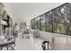 Bright sunroom with large windows offering a view of the trees at 542 Lakeside Dr # 542, Bradenton, FL 34210