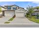 Charming two-story townhome features a private two-car garage and beautiful Mediterranean-style architecture at 6065 Worsham Ln # 104, Bradenton, FL 34211
