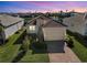 Aerial view of a single-Gathering home with a red tile roof, landscaped yard, and a brick driveway at 6247 Champions Row St, Bradenton, FL 34210