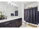 Modern bathroom featuring dark wood cabinets, white countertops, and a neutral color scheme at 6247 Champions Row St, Bradenton, FL 34210