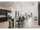 Open concept kitchen with granite counters, stainless appliances, and bar stool seating at 6247 Champions Row St, Bradenton, FL 34210