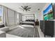 Bright and airy main bedroom with neutral decor, large windows, and a canopy bed at 6247 Champions Row St, Bradenton, FL 34210