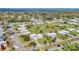 An aerial view showcases the neighborhood's lush green landscape and waterfront location near the water at 7304 11Th W Ave, Bradenton, FL 34209