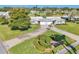 Single-story home boasting lush green lawns, a beautiful landscape design, and an attached single-car garage at 7304 11Th W Ave, Bradenton, FL 34209