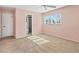 This bedroom features carpet, a ceiling fan, and an ensuite bathroom at 7304 11Th W Ave, Bradenton, FL 34209