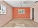 This bedroom features carpet, a ceiling fan, and a window providing natural light at 7304 11Th W Ave, Bradenton, FL 34209