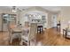 Dining area with hardwood floors and ample seating, creating a warm atmosphere for gatherings at 7304 11Th W Ave, Bradenton, FL 34209