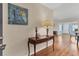Inviting entryway with hardwood floors and a decorative table adorned with nautical-themed decor at 7304 11Th W Ave, Bradenton, FL 34209