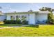 Charming single-story home with well-maintained lawn and inviting front entrance at 7304 11Th W Ave, Bradenton, FL 34209