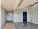Spacious garage featuring a door to the outside and plenty of room for parking and storage at 7304 11Th W Ave, Bradenton, FL 34209