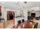 Open-concept kitchen and breakfast bar with views to the living room at 1269 Western Pine Cir, Sarasota, FL 34240
