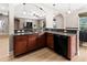 Kitchen breakfast bar and granite countertops. Opens to living room and breakfast nook at 1269 Western Pine Cir, Sarasota, FL 34240