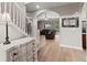 Bright entryway with staircase leads to an open-concept living area with backyard pool views at 1269 Western Pine Cir, Sarasota, FL 34240