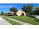 Well-maintained home with lush front lawn and mature trees at 1269 Western Pine Cir, Sarasota, FL 34240