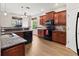 Bright kitchen with wood cabinets, granite countertops, and stainless steel appliances at 1269 Western Pine Cir, Sarasota, FL 34240
