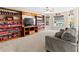Spacious living room with built-in shelves, ceiling fan, and comfortable seating at 1269 Western Pine Cir, Sarasota, FL 34240