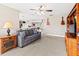 Comfortable living room with ceiling fan and casual seating at 1269 Western Pine Cir, Sarasota, FL 34240