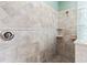 Elegant tiled shower with glass block accent and built-in shelves at 1269 Western Pine Cir, Sarasota, FL 34240