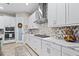 Modern kitchen features stainless steel appliances, stylish backsplash, and sleek countertops at 13891 Heartwood Way, Parrish, FL 34219