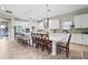 Bright open kitchen with an island, modern lighting, and breakfast bar seating at 13891 Heartwood Way, Parrish, FL 34219