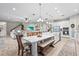 Open-concept kitchen features a large island, stainless appliances, and seamlessly connects to the living room at 13891 Heartwood Way, Parrish, FL 34219