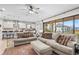 Living room showcases modern furniture and sliding glass doors to the outdoor living space at 13891 Heartwood Way, Parrish, FL 34219